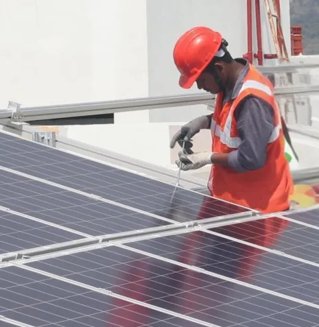 Worker installing solar panels